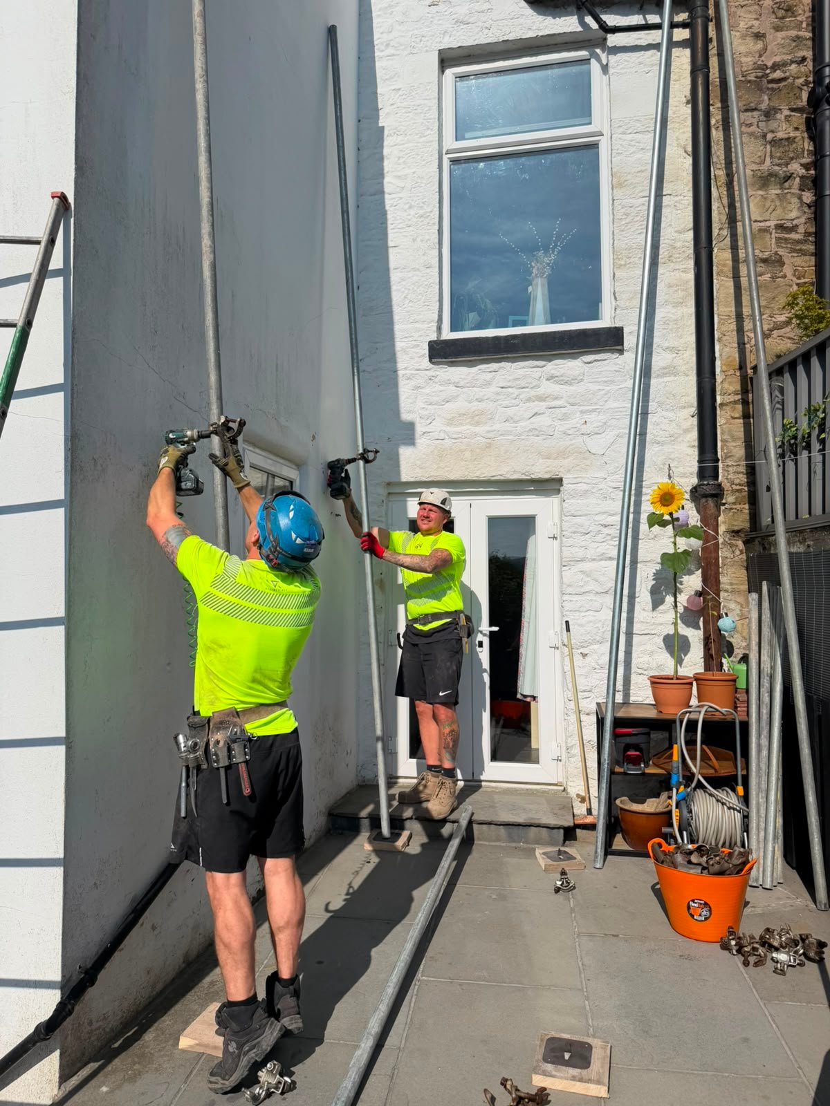 City Scaffolding scaffolders assembling access framework on site